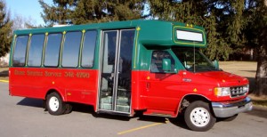 Go to the baggage claim level, outside to the outer island. Take the red/green shuttle van (Boise Shuttle Service) to the Towneplace Suites Downtown. (There is another Towneplace in Meridian)